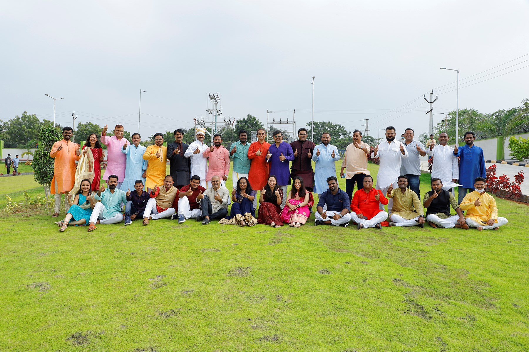 A group of people standing on a lawn in India