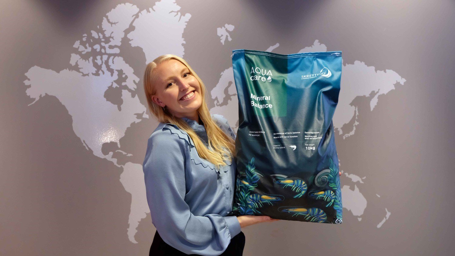 Marita Sirevaag holding an AquaCare bag