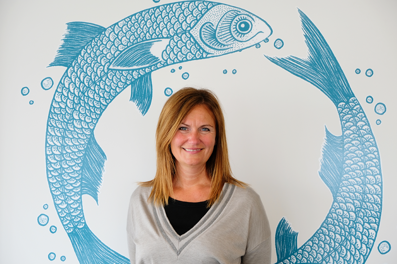 Therese Log Bergjord with fish illustrations in the background