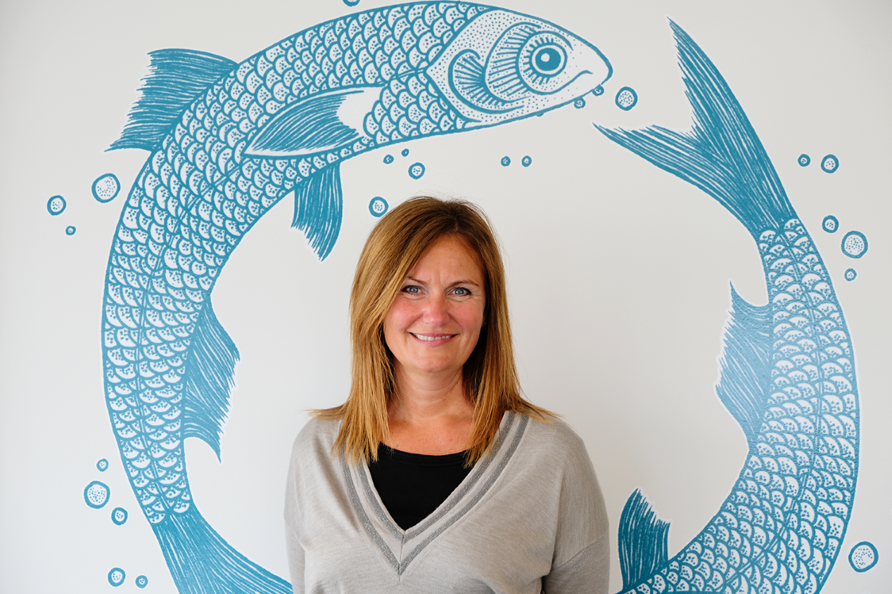 Therese Log Berjgord with fish illustrations in the background