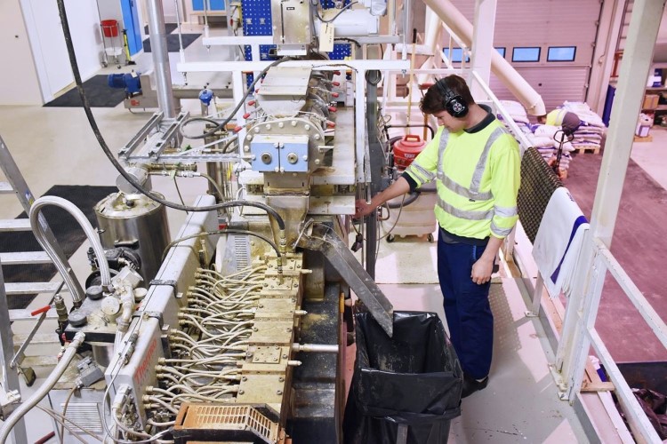 Worker in Skretting Feed Technology Plant