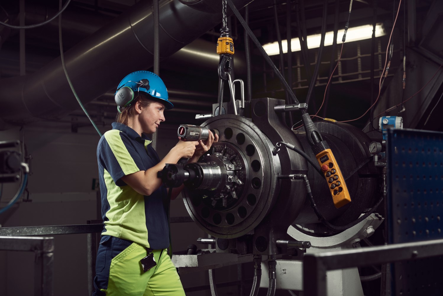 Factory worker operating equipment