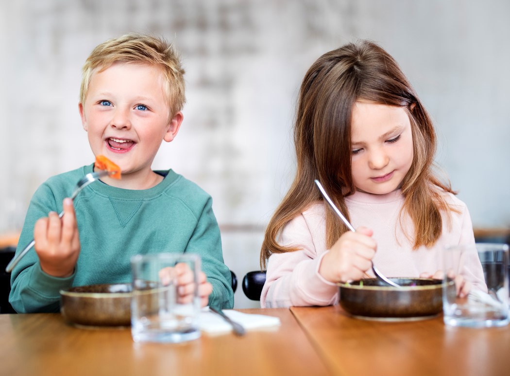 Kids eating salmon